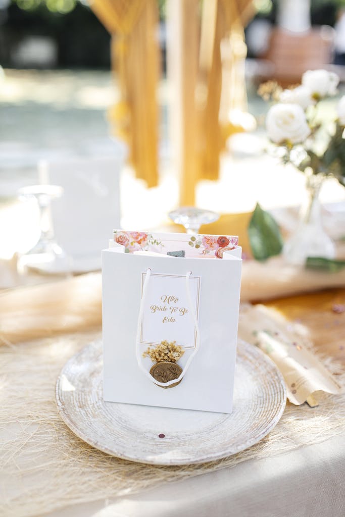 Beautifully designed gift bag on a sunlit outdoor table, perfect for celebrations.
