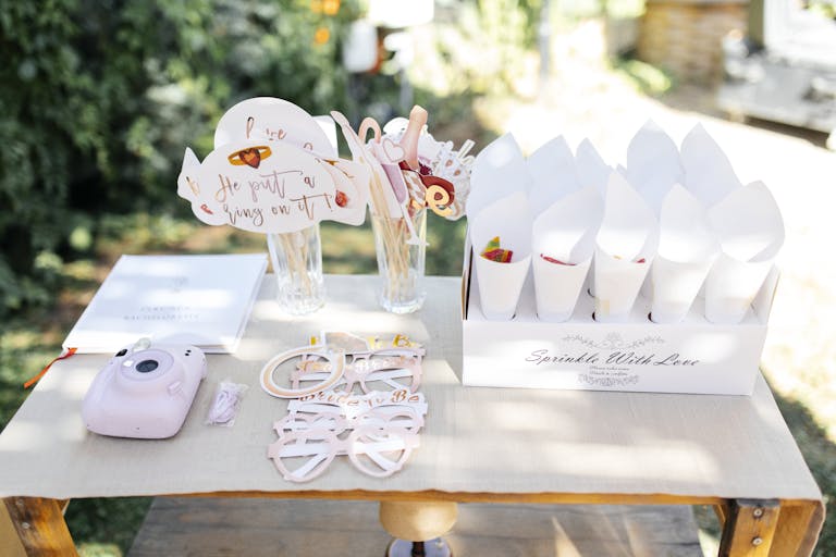 Charming outdoor setup with instant camera and festive decorations perfect for summer gatherings.
