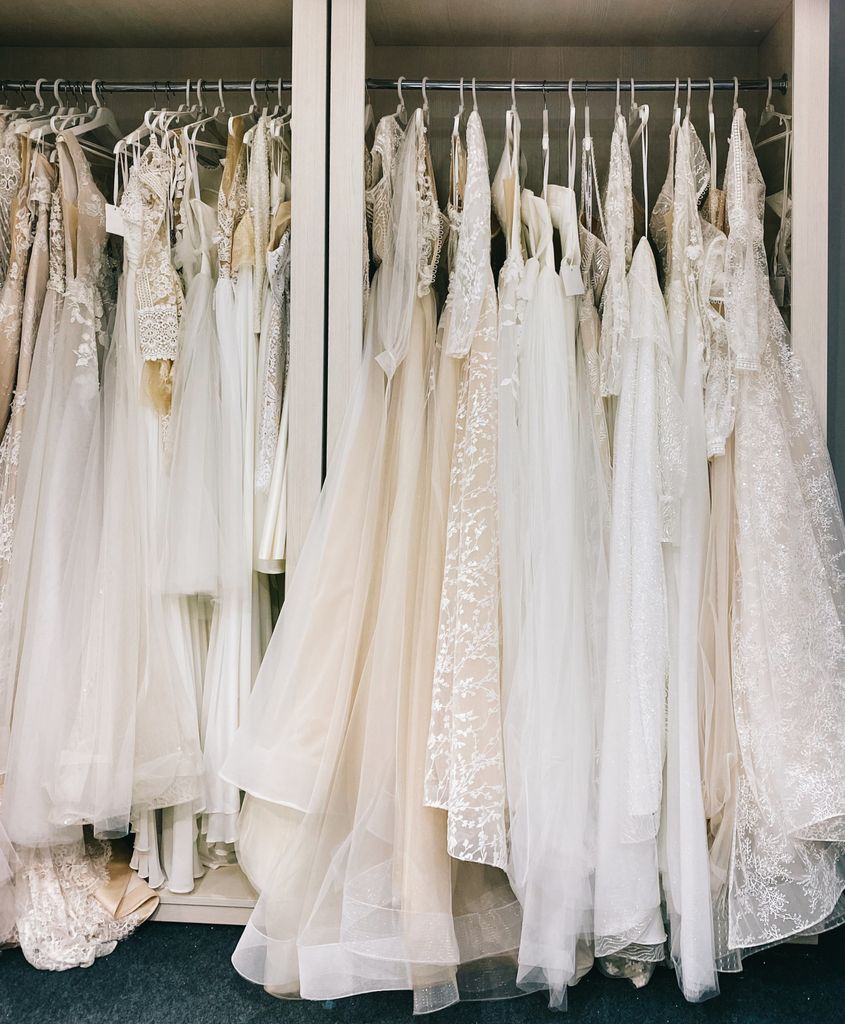 Collection of bridal gowns elegantly hanging in a boutique in Vilnius, Lithuania.